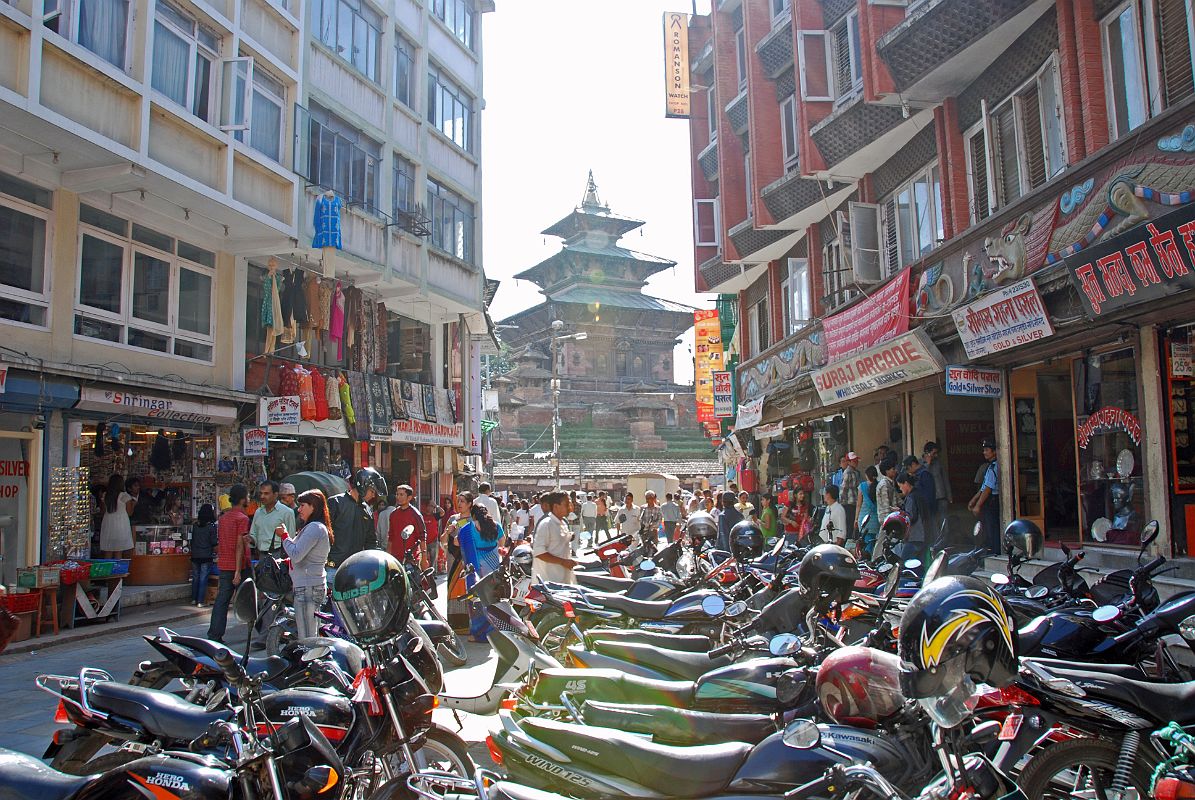 Kathmandu Durbar Square 06 05 Taleju Temple Motorcycles line the street at the north entrance to Kathmandu Durbar Square, with Taleju Temple visible the square.
